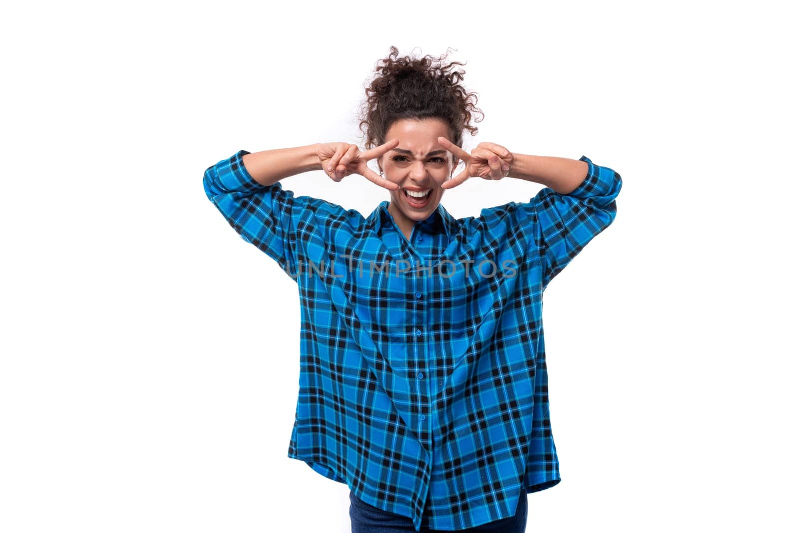 young serious european woman with curly hair thinking on white background.