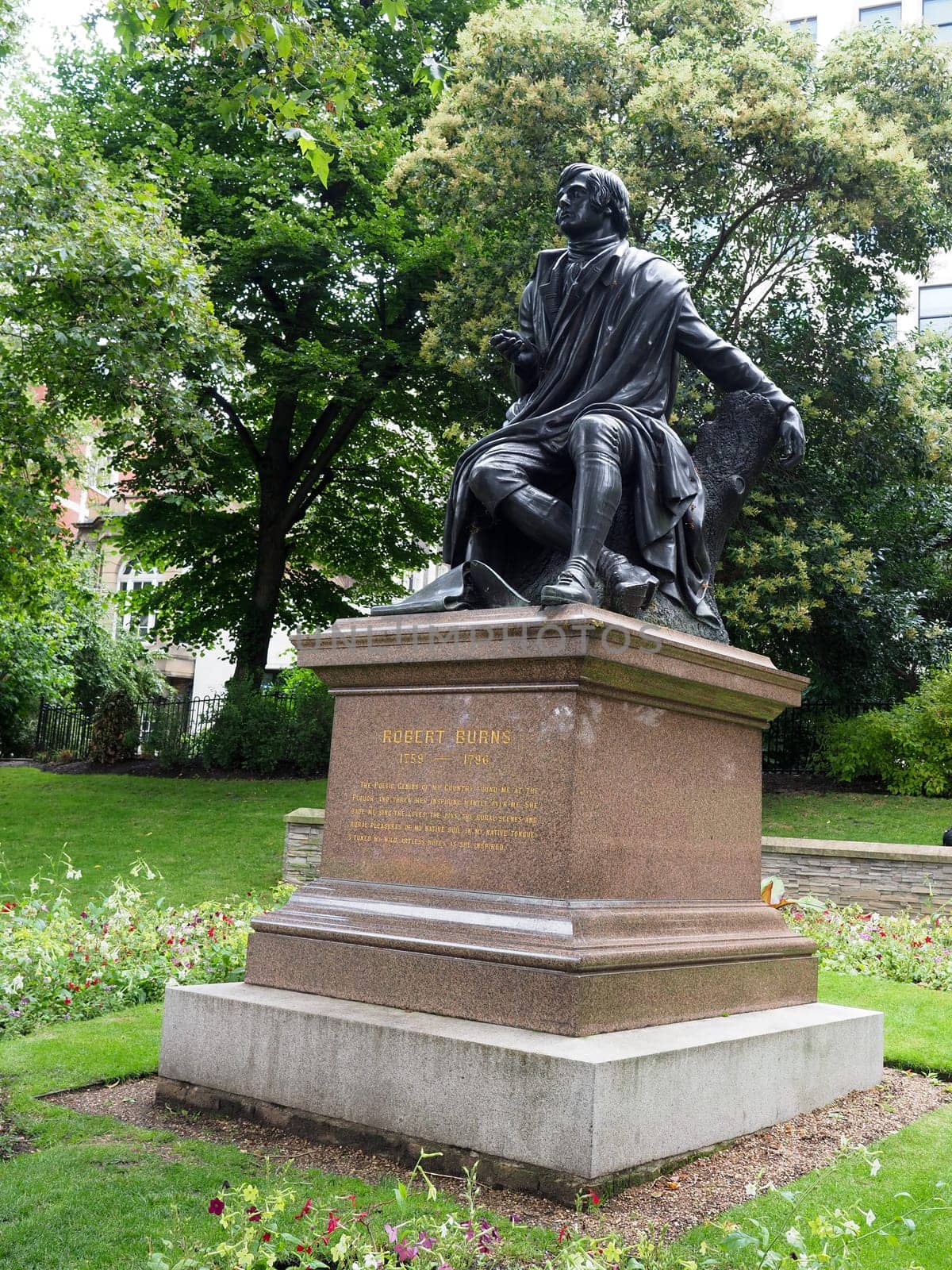 A marble and bronze outdoor statue to this poet Robbie Burns situated in London England