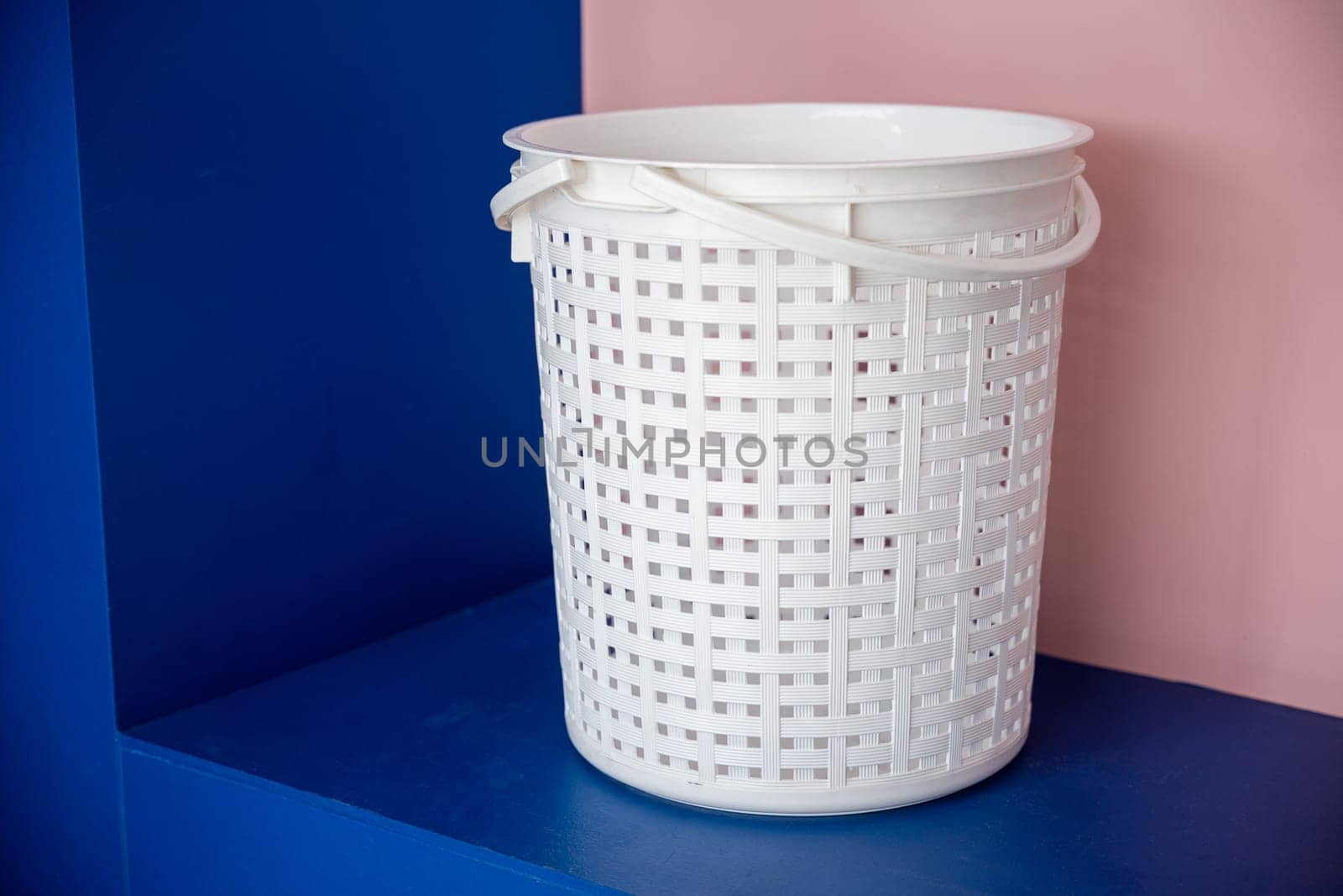 Empty new white plastic laundry clothes basket at convenience store for support customer, Laundromat convenience store, Laundry and housework concept