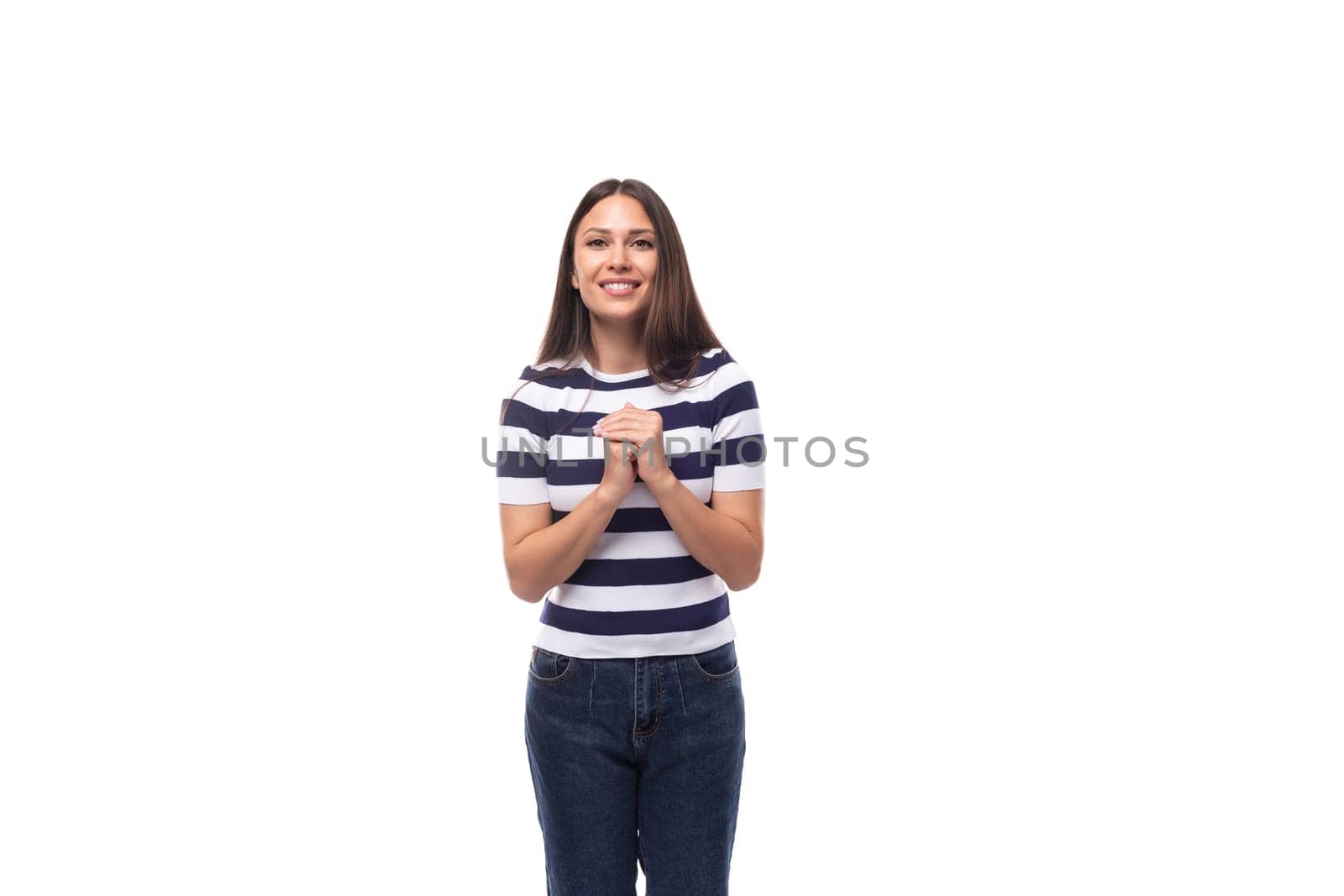 cute young european woman with black straight hair wears striped black and white t-shirt and jeans in summer. people clothes concept.