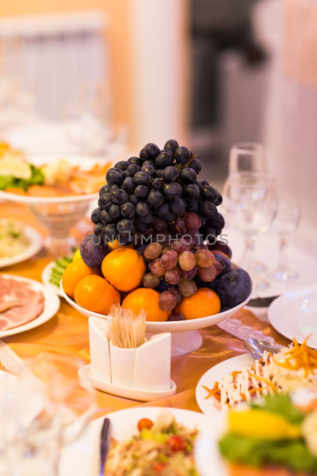 Mixed fruits on the festive table by Satura86