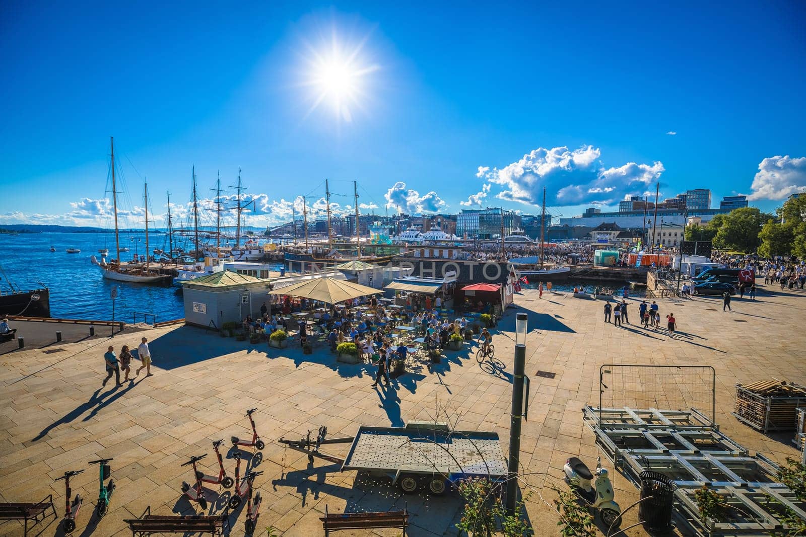 Oslo, Norway, August 27 2022: Scenic Oslo waterfront promenade summer view. Many people walking on favourite tourist spot in bright summer day. capital of Norway