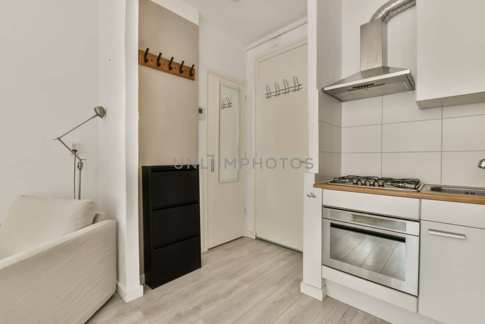 a kitchen area with an oven, sink and dishwasher on the floor in a room that has white walls