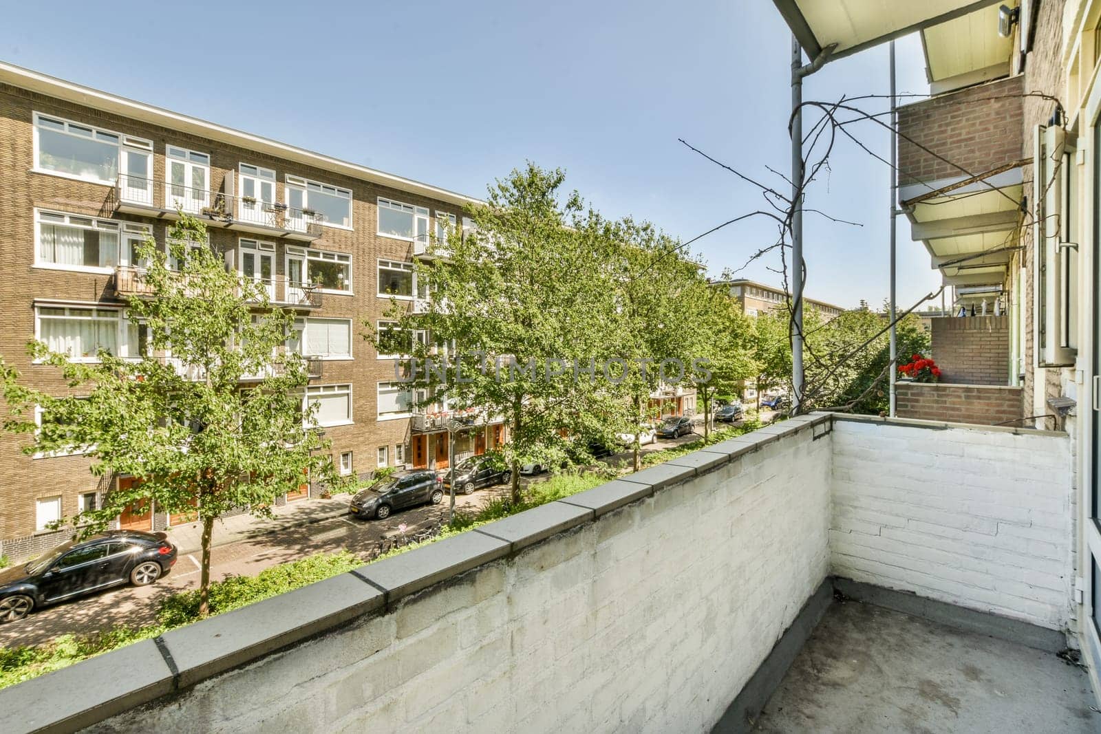 a balcony or terrace with a brick wall and by casamedia