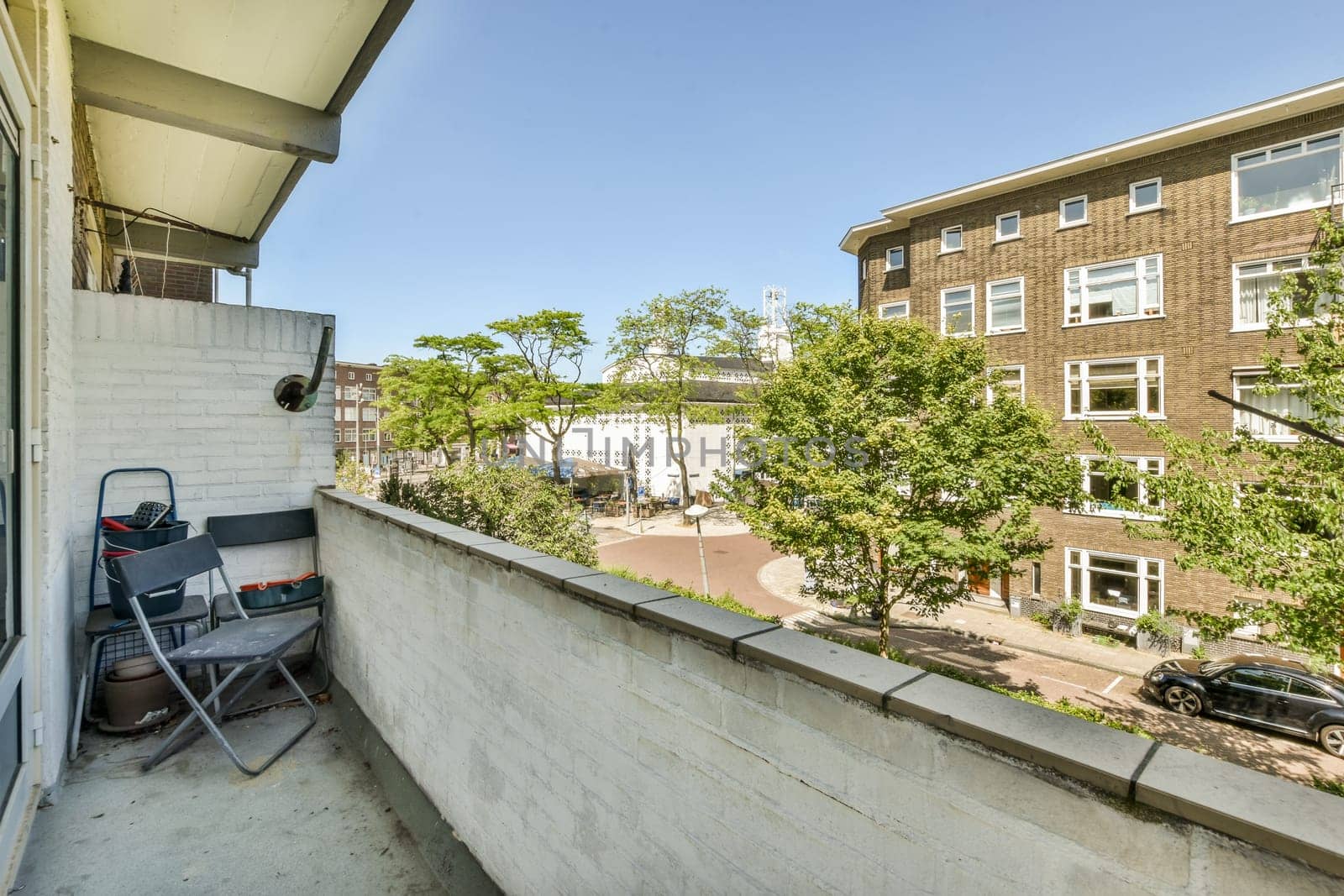 the view from the balcony of a brick apartment building by casamedia