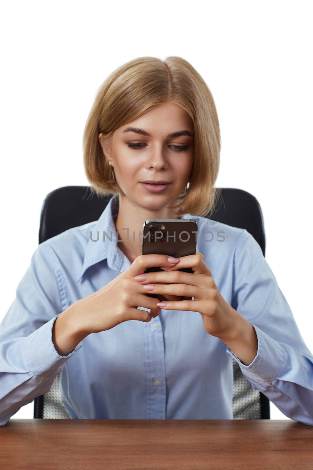 pretty blonde business woman using phone in the office