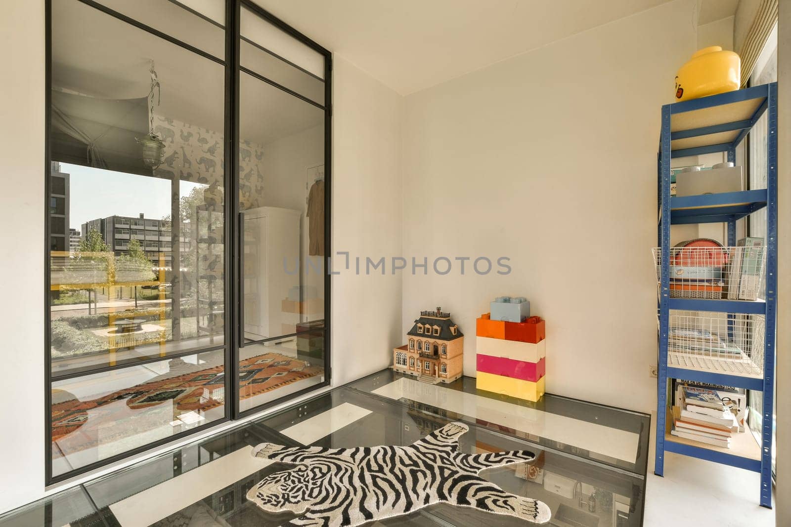 a room with a zebra laying on the floor by casamedia
