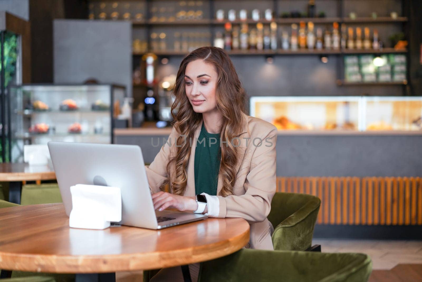 Business Woman Restaurant Owner Use Laptop Dressed Elegant Pantsuit Sitting In Restaurant