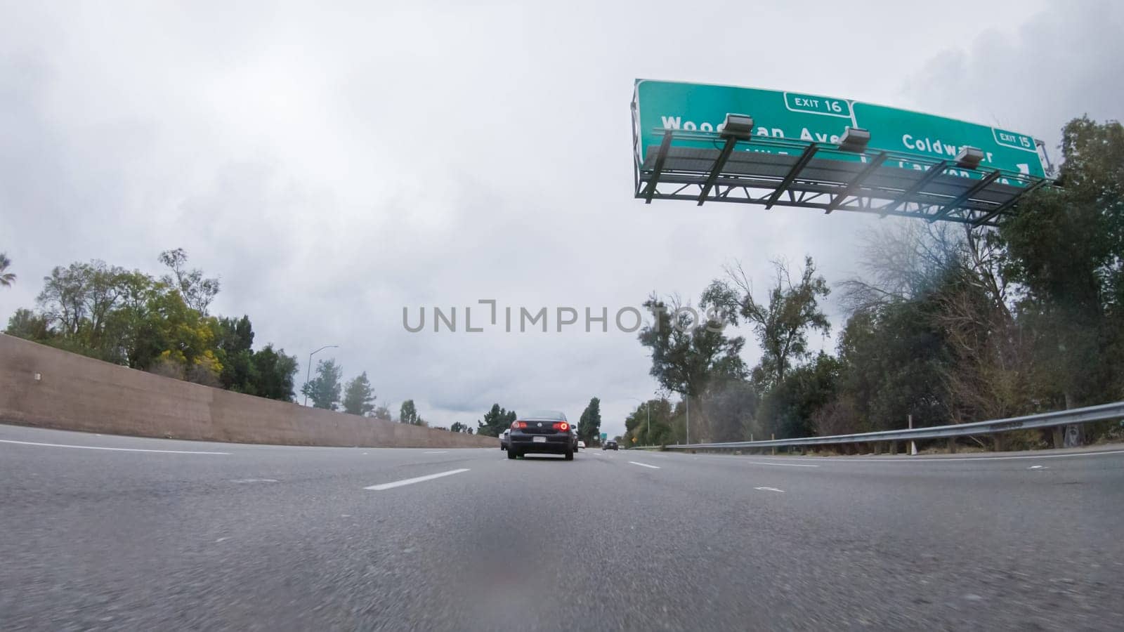 Los Angeles, California, USA-December 4, 2022-POV-Amidst a rainy winter day, driving on HWY 134 near Los Angeles, California, captures the atmosphere through raindrop-covered lenses, adding a unique and moody perspective to the journey.