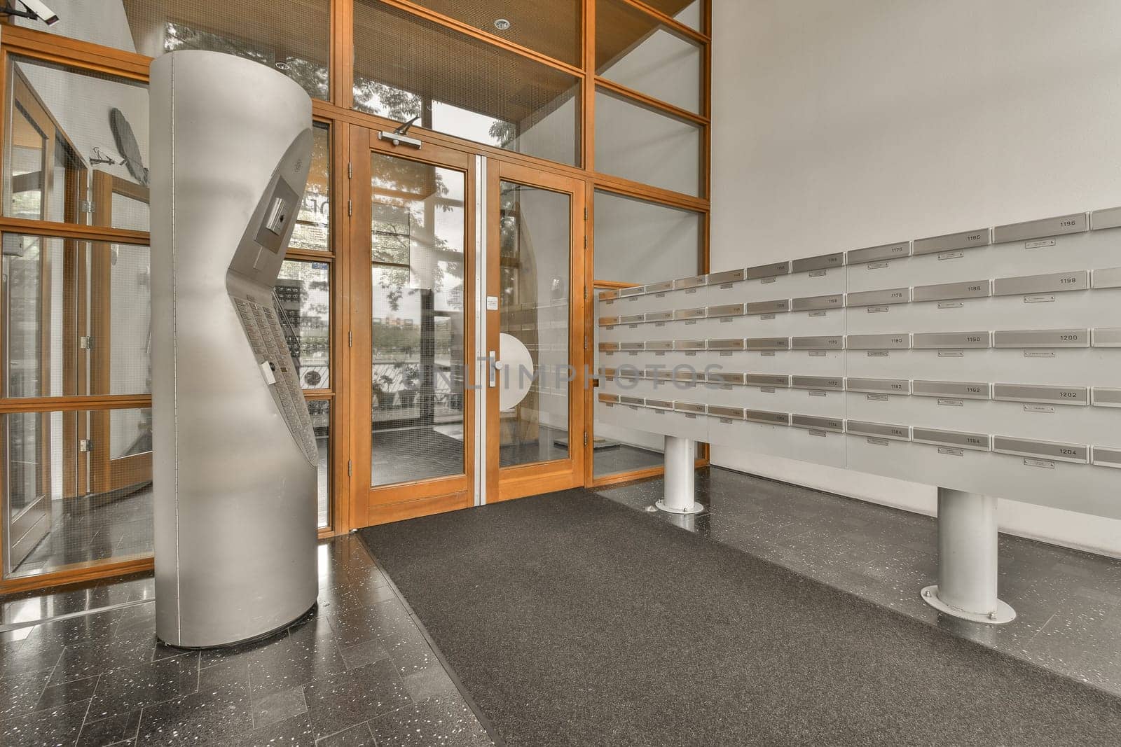 a public urinal and glass doors in a building by casamedia