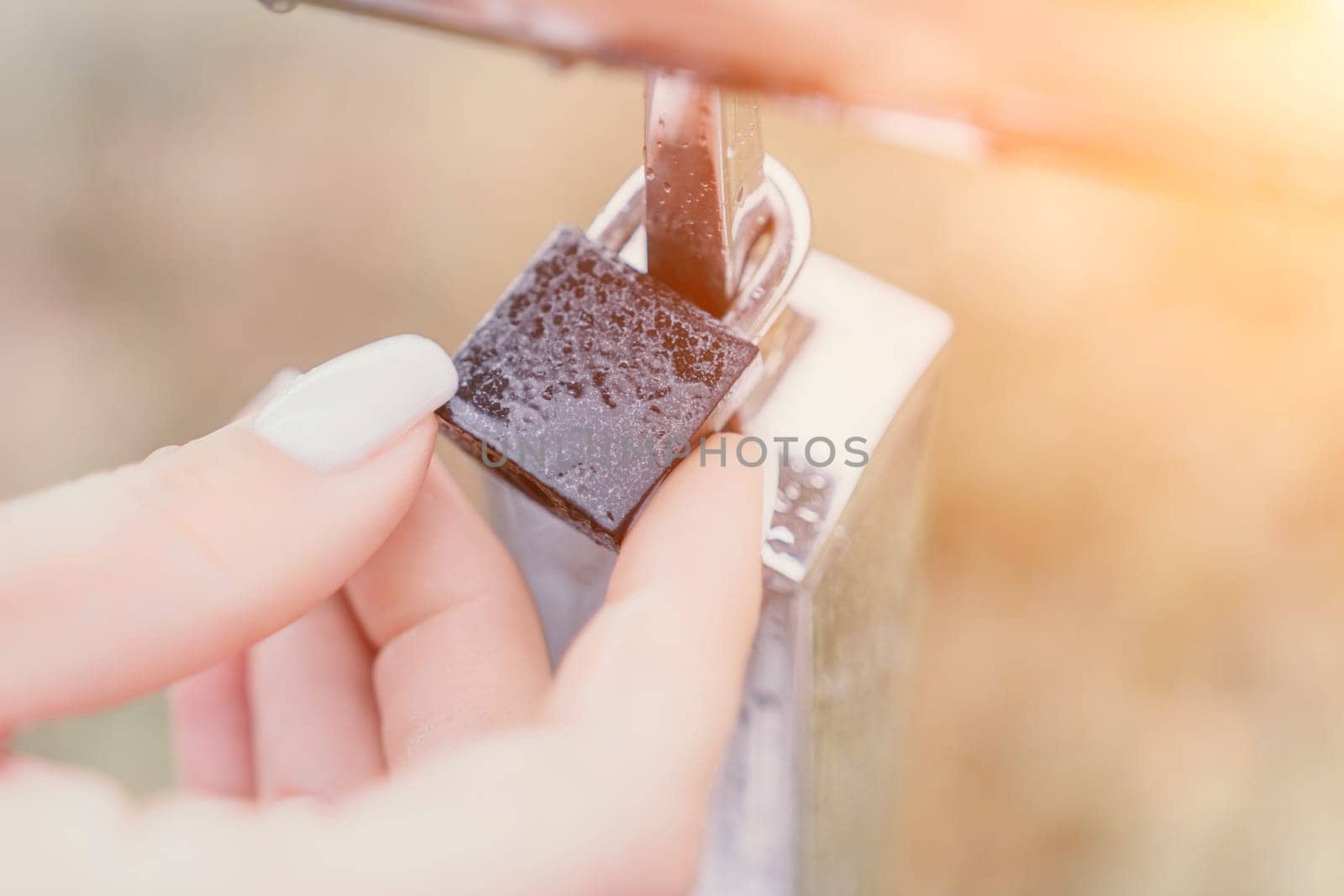 Wedding heart golden lock on stainless iron fence valentines day symbol of eternal love a wedding by panophotograph