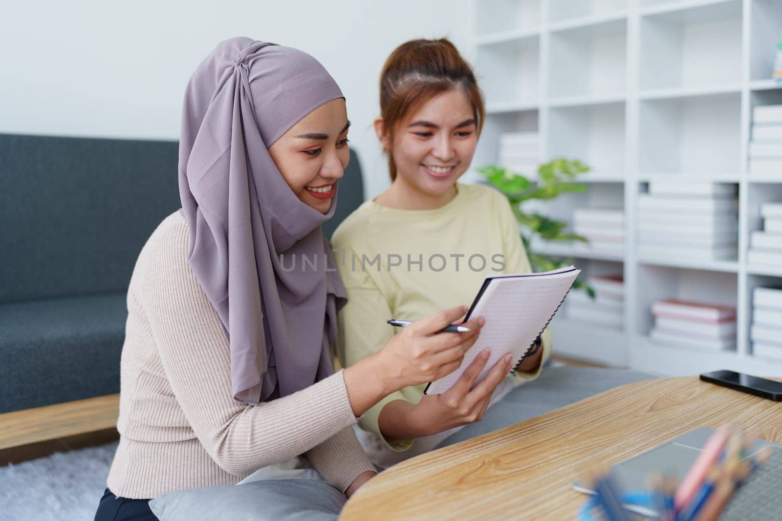 Muslim undergraduates and Asian women are studying online using computers