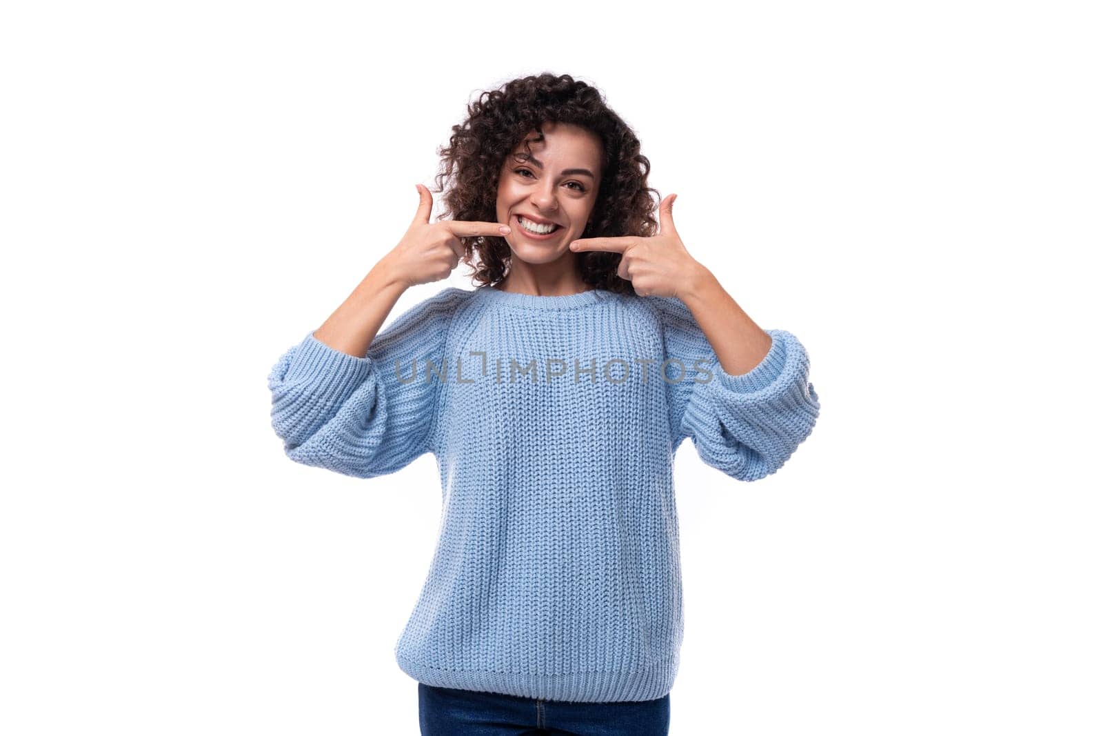 young authentic brunette lady with curly hair style smiling on background with copy space.