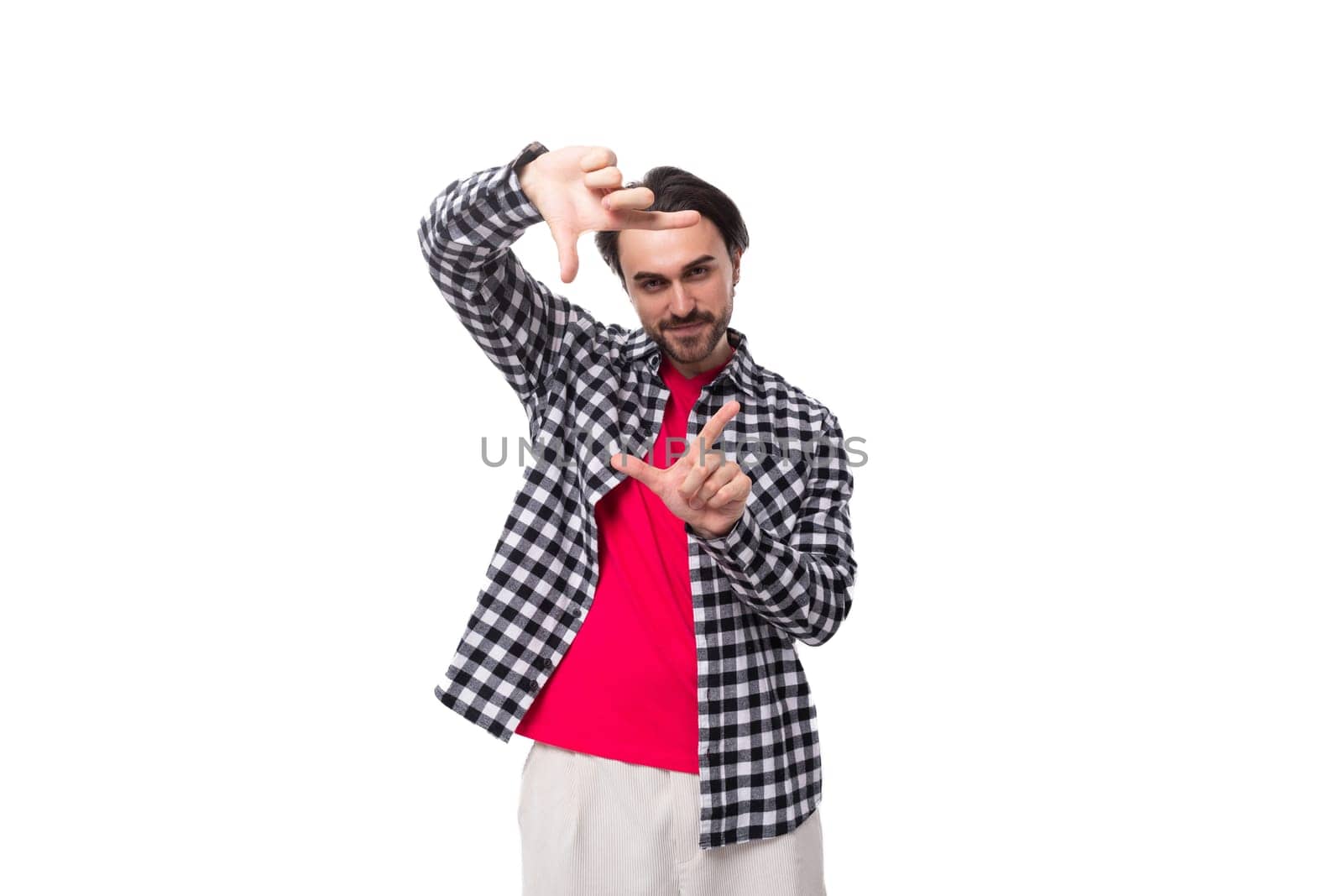 young brunet caucasian man with cool hairstyle and beard gesturing by TRMK