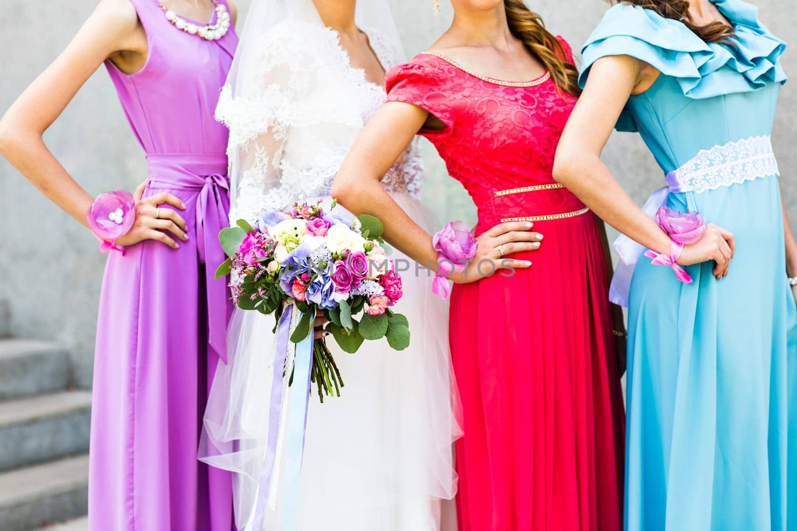 Bride with bridesmaids outdoors on the wedding day by Satura86