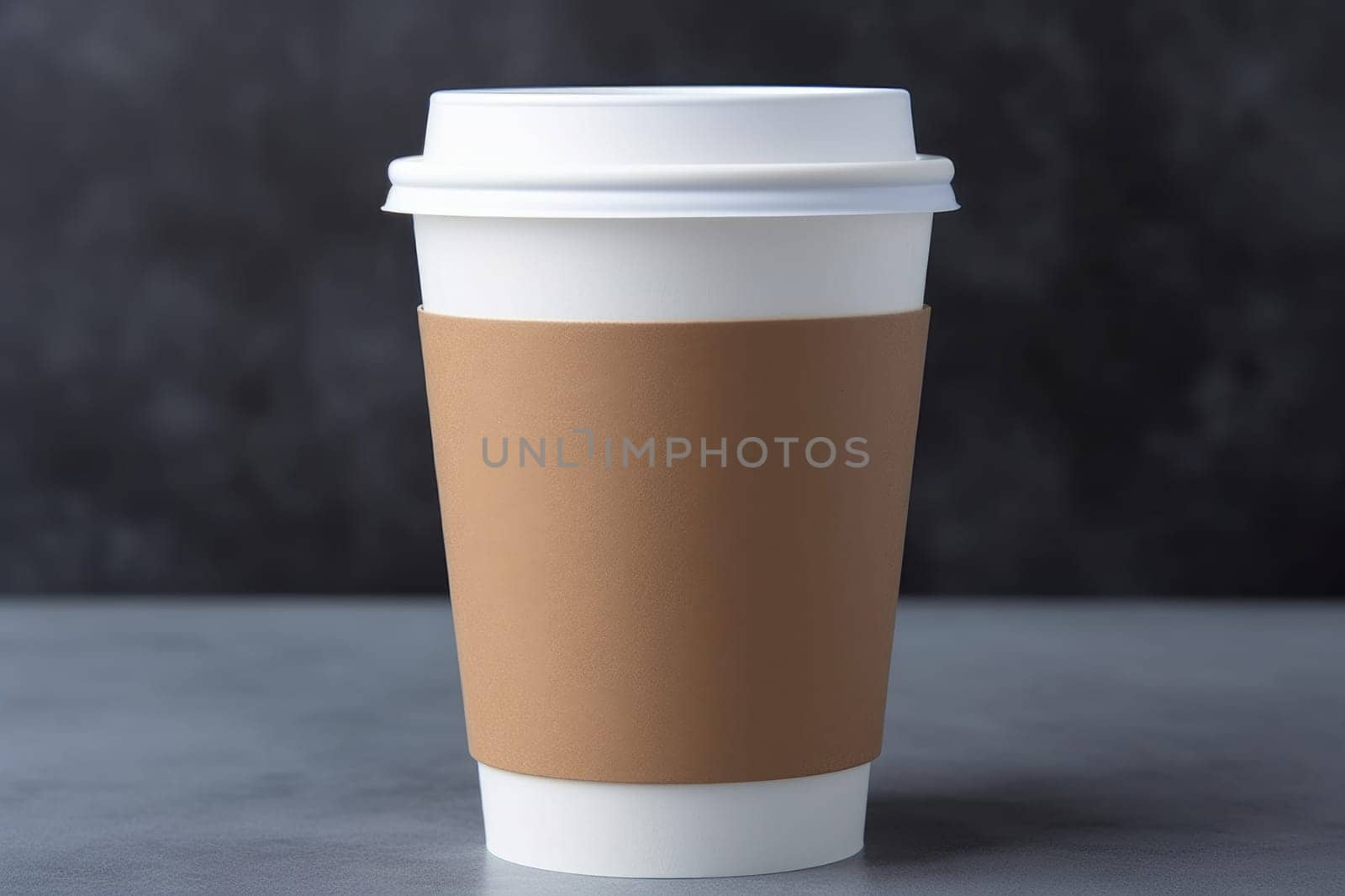 Paper cup for coffee on a concrete surface on a blurred background.