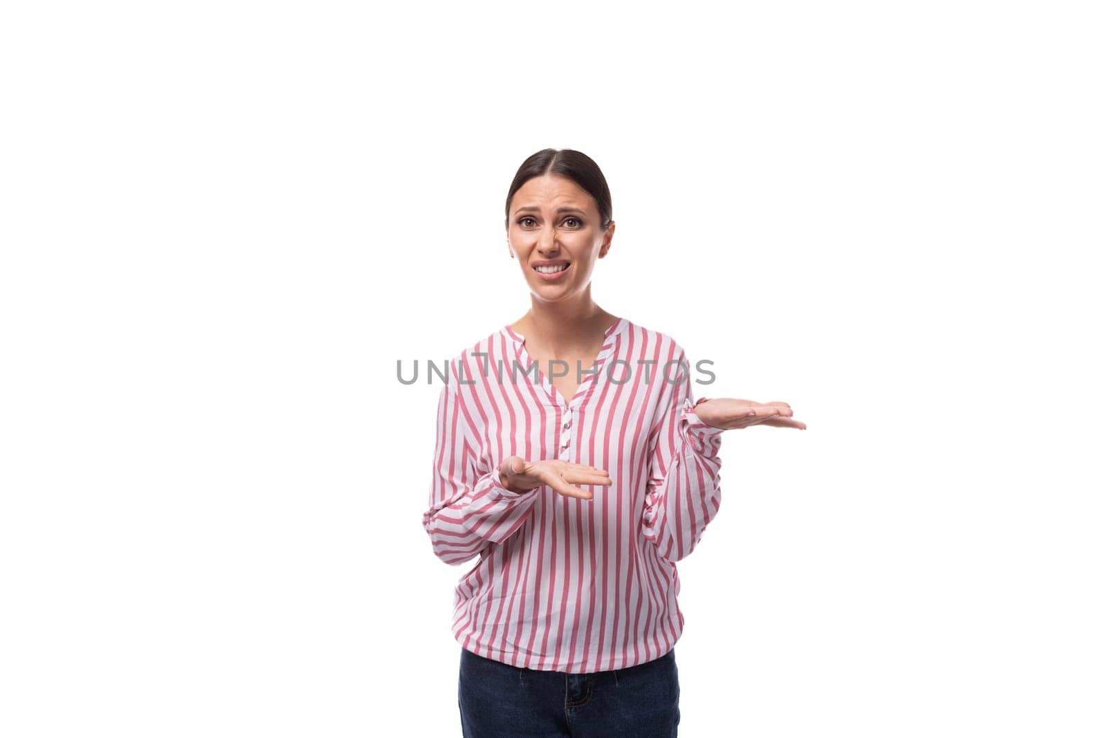 young successful smart brunette business woman dressed in a striped shirt on a white background with copy space.