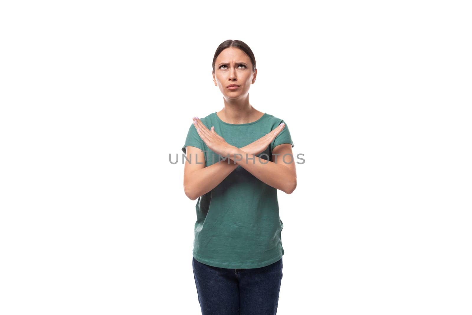 young confident slender woman dressed in a green basic t-shirt with print mockup crossed her arms in front of her by TRMK