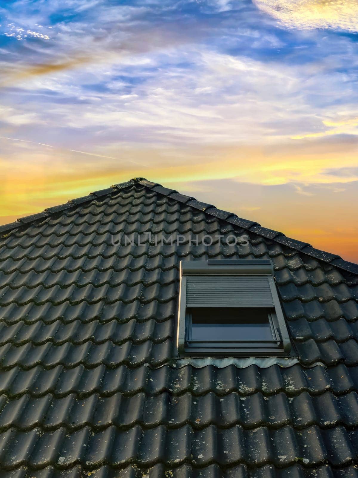 Open roof window in velux style with black roof tiles. by MP_foto71