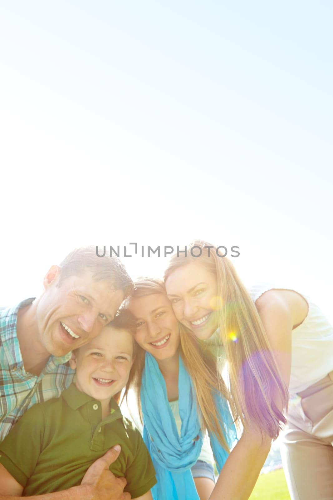Family fun in the sunshine. A cute young family spending time together outdoors on a summers day