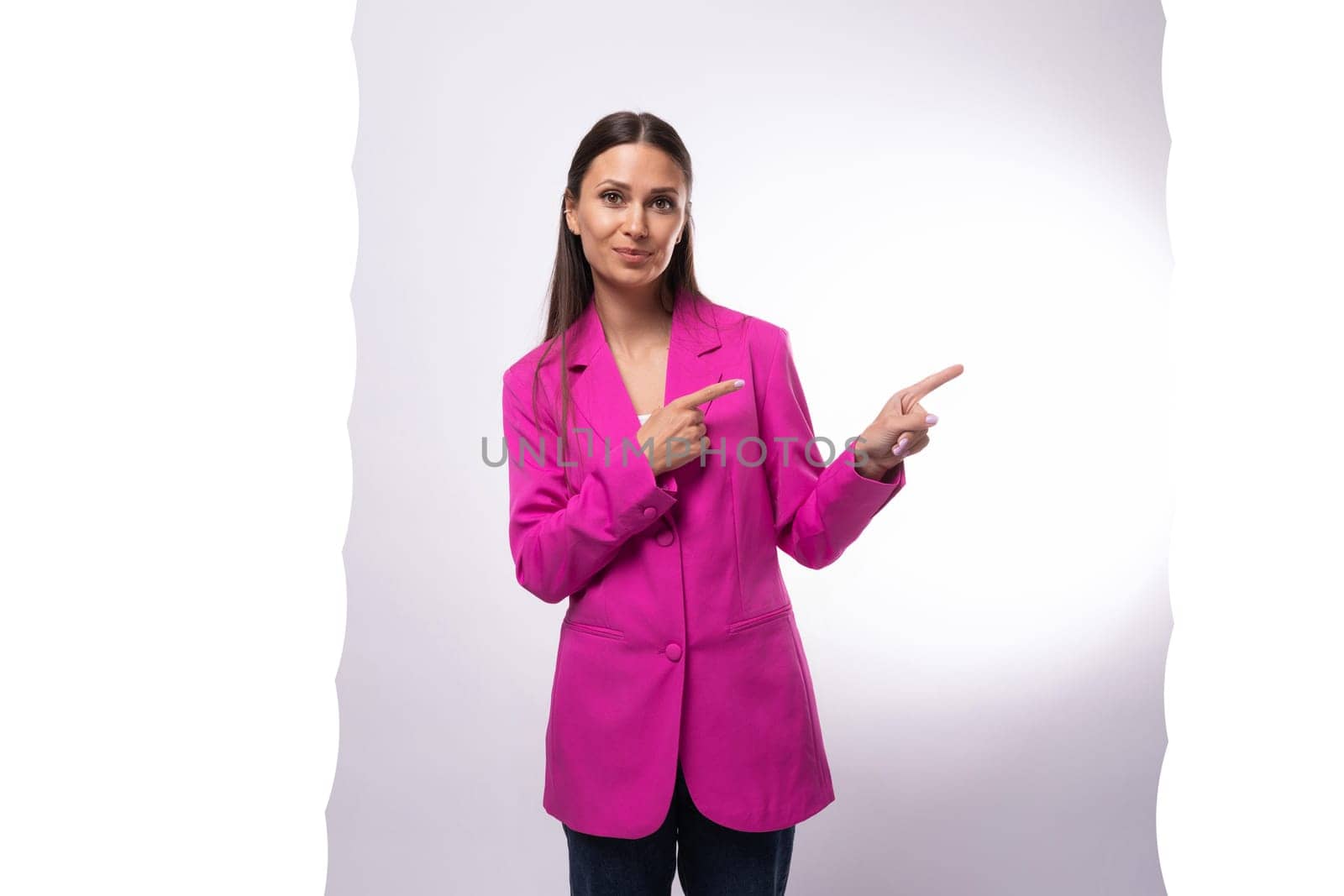 a young caucasian brunette business lady dressed in a bright crimson jacket points her hand to the side by TRMK