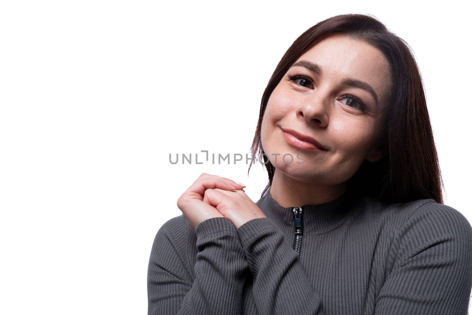 Casual young brunette woman wearing a marsh-colored turtleneck on a white background, close-up by TRMK