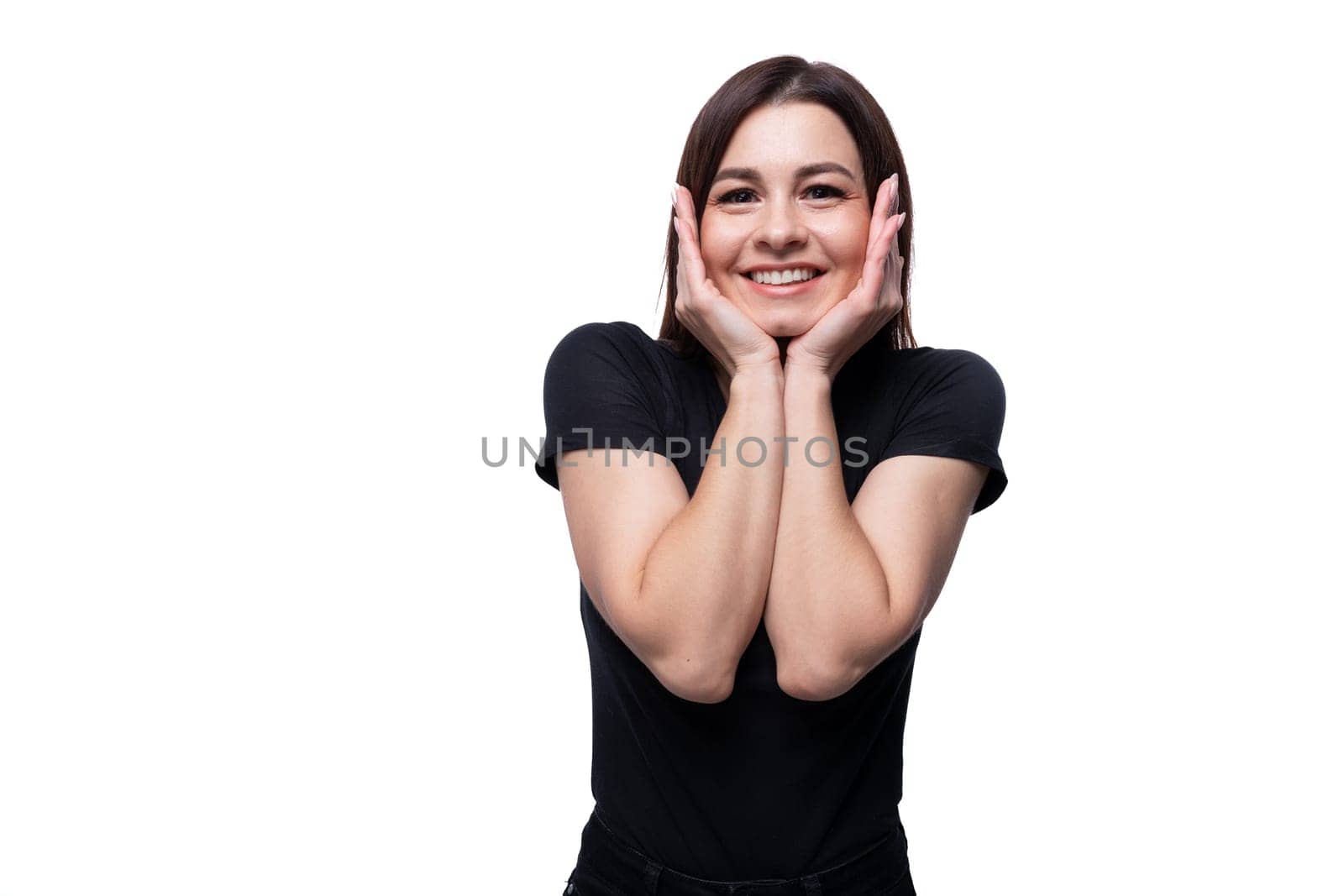 25 year old cute woman with straight black hair is surprised on a background with copy space.