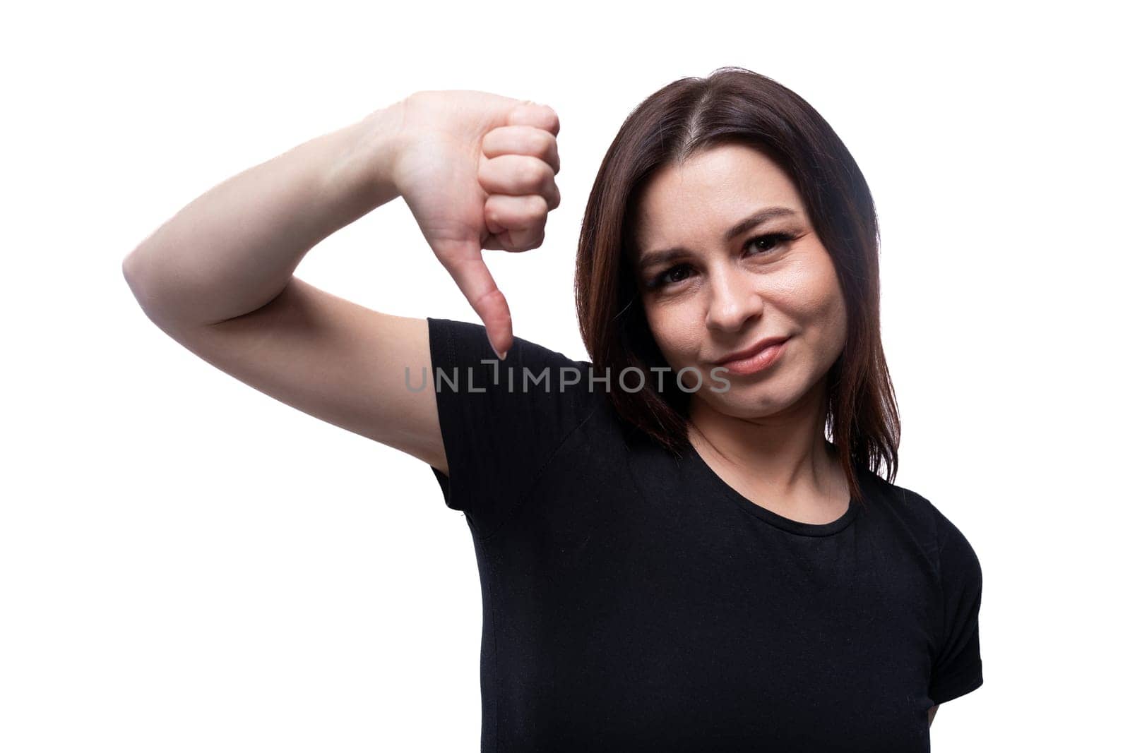 Caucasian young pretty brunette woman with black hair on a background with copy space.