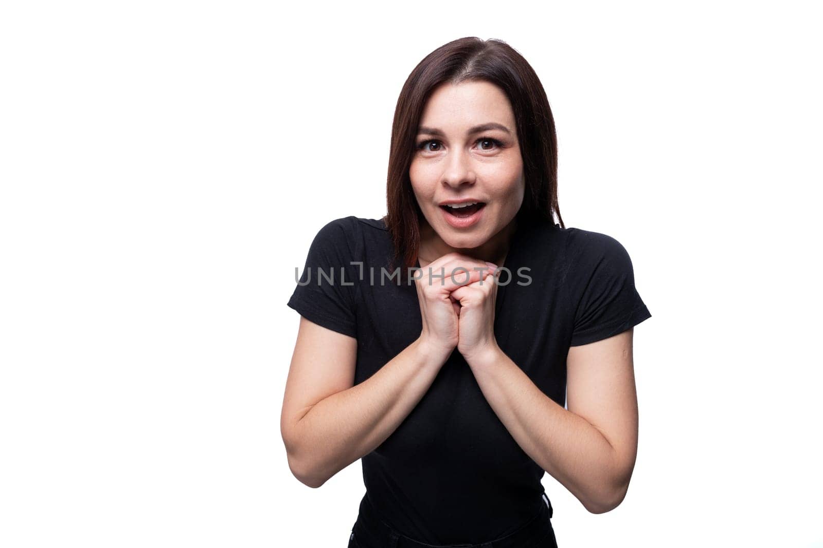 Caucasian young attractive brunette woman wearing a black t-shirt on a white background by TRMK