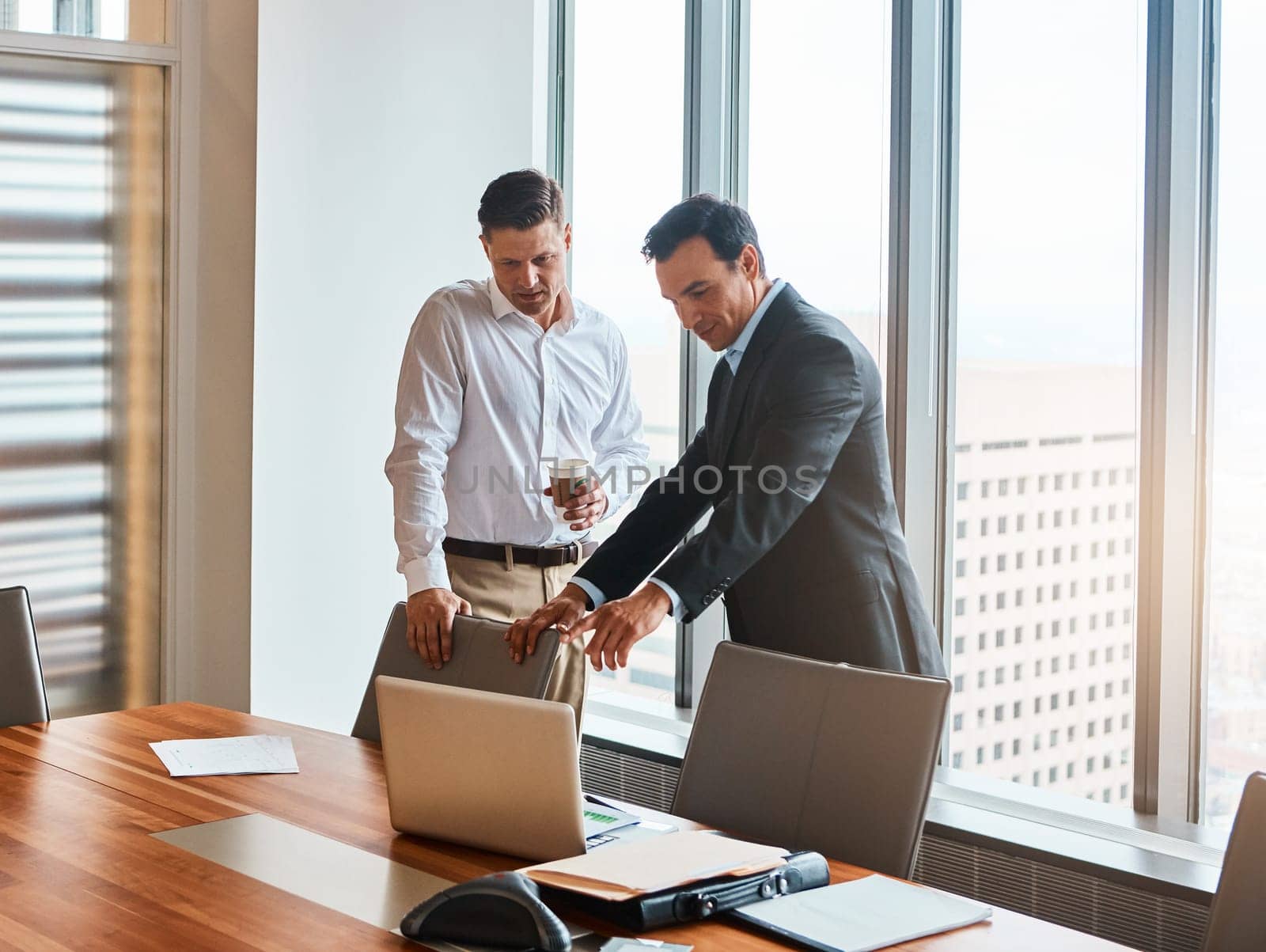 Technology makes succeeding so much easier. mature businessmen working in a corporate office