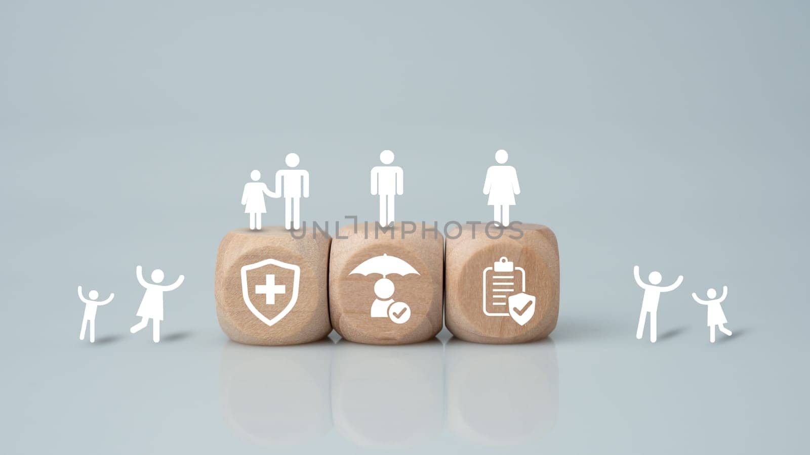 Concept of health insurance and medical benefits. Wooden blocks with icons printed on them. Health insurance and access to treatment, health care planning. by Unimages2527