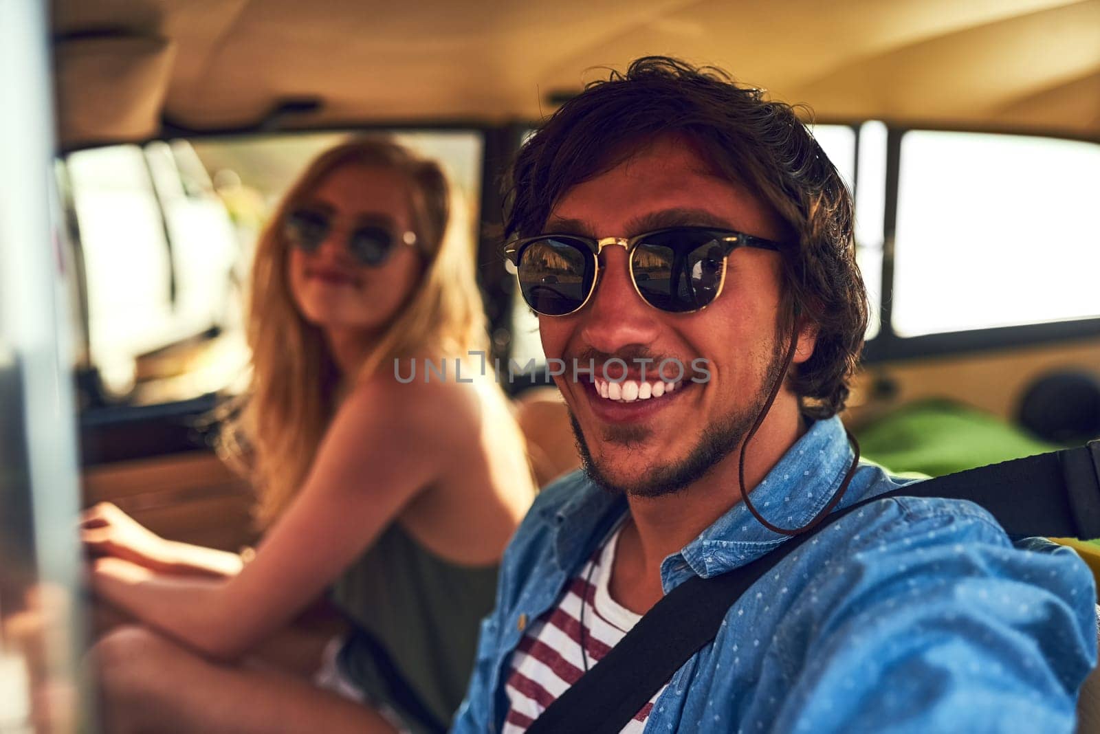 Theres no one else Id rather travel with. Cropped portrait of an affectionate young couple taking a roadtrip together. by YuriArcurs