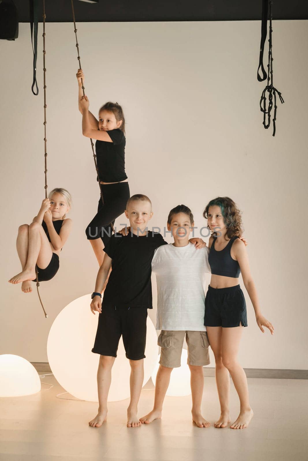 Portrait of a group of children in the fitness room. Children's yoga by Lobachad