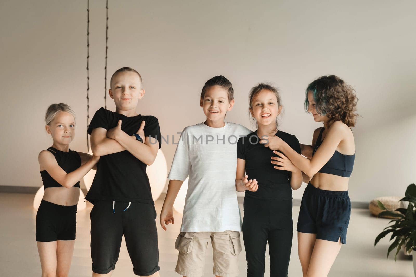 Portrait of a group of children in the fitness room. Children's yoga.