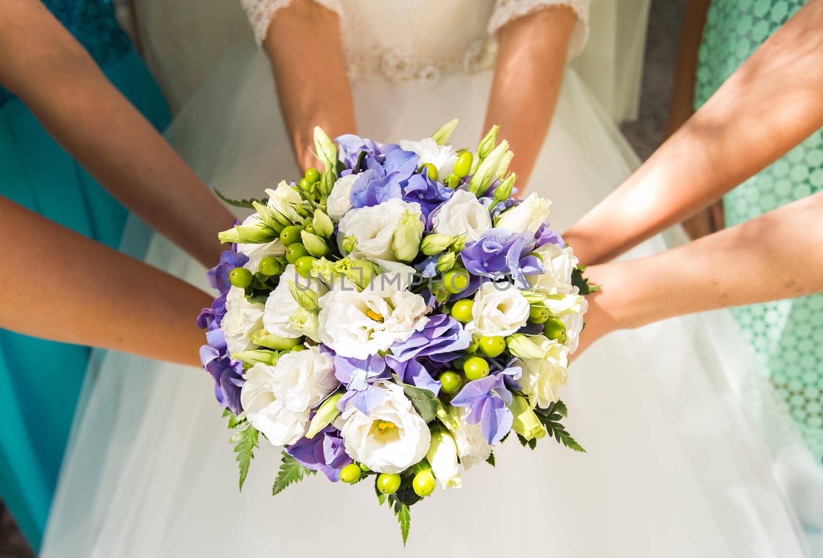 Close up of bride and bridesmaids bouquet by Satura86