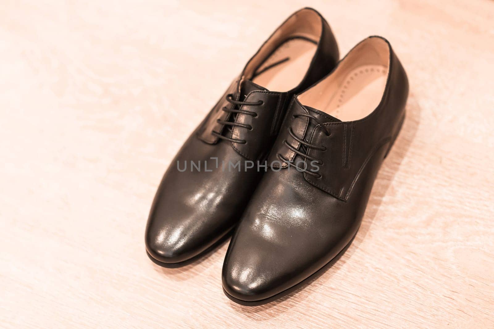 Close-up of elegant mens shoes on wooden background