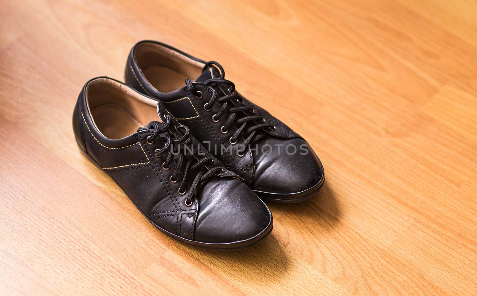 Close-up of elegant mens shoes on wooden background