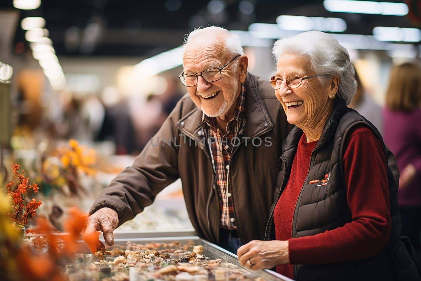 Elderly people looking at souvenirs at a counter at an exhibition. High quality photo