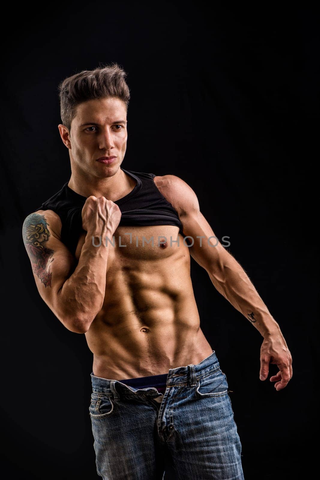 Photo of a shirtless man with captivating blue and green eyes posing for a striking picture by artofphoto