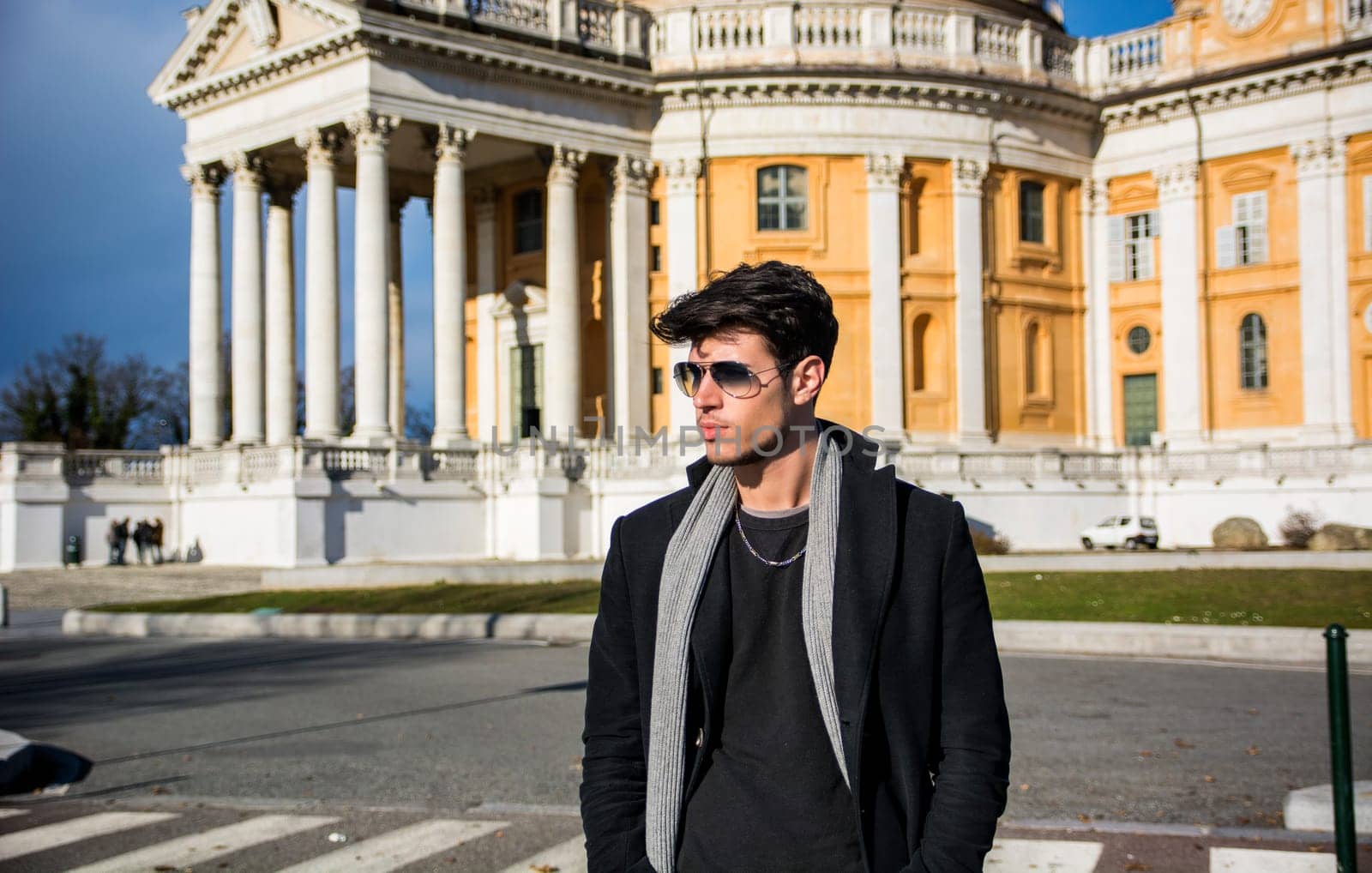 A man standing in front of Basilica di Superga, church in Turin, Italy