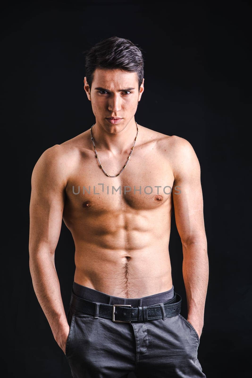 Photo of a shirtless man striking a pose for the camera by artofphoto