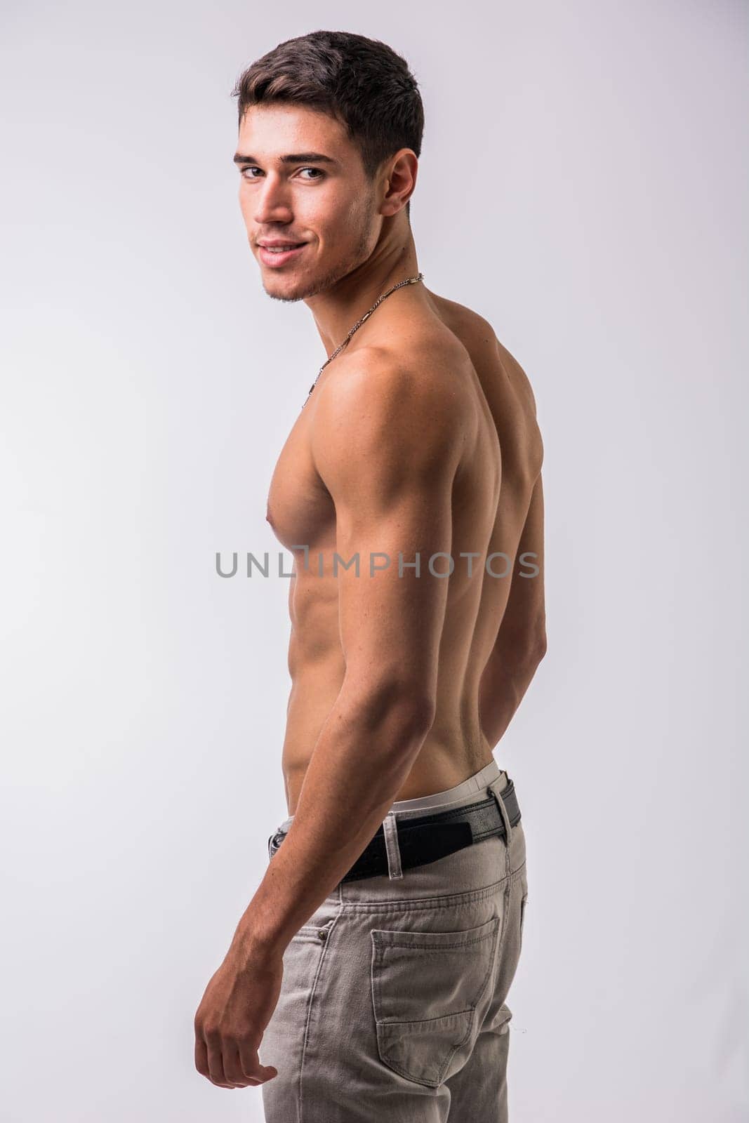 Photo of a shirtless man posing confidently for a photo by artofphoto