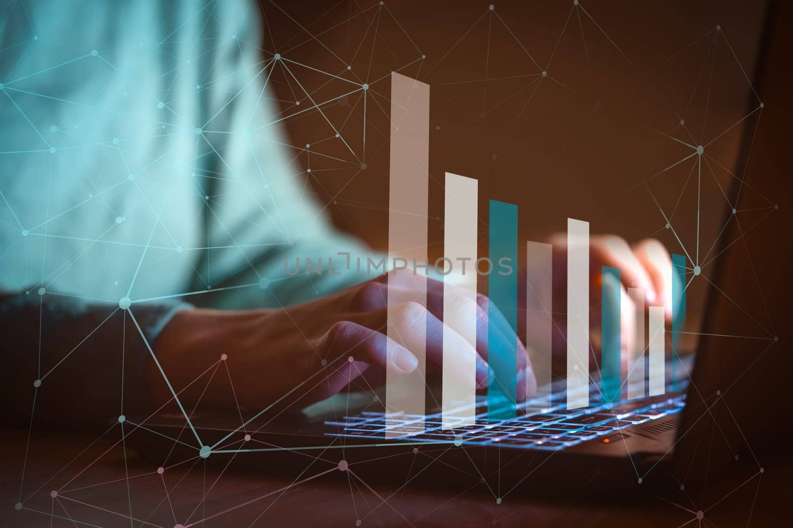 The concept of development, with a graph of growth and statistics on profits, an analysis of consumer needs, hands are typing on a laptop keyboard, a person works and develops business, closeup view.