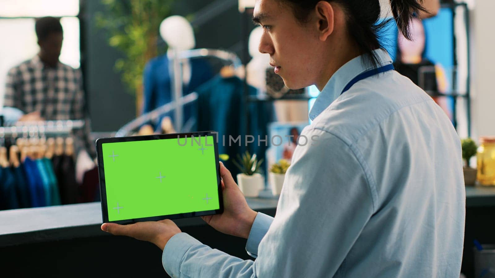 Store manager analyzing tablet computer by DCStudio