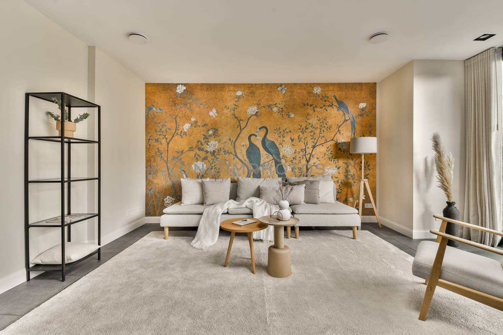 a living room with a couch and a wall mural by casamedia
