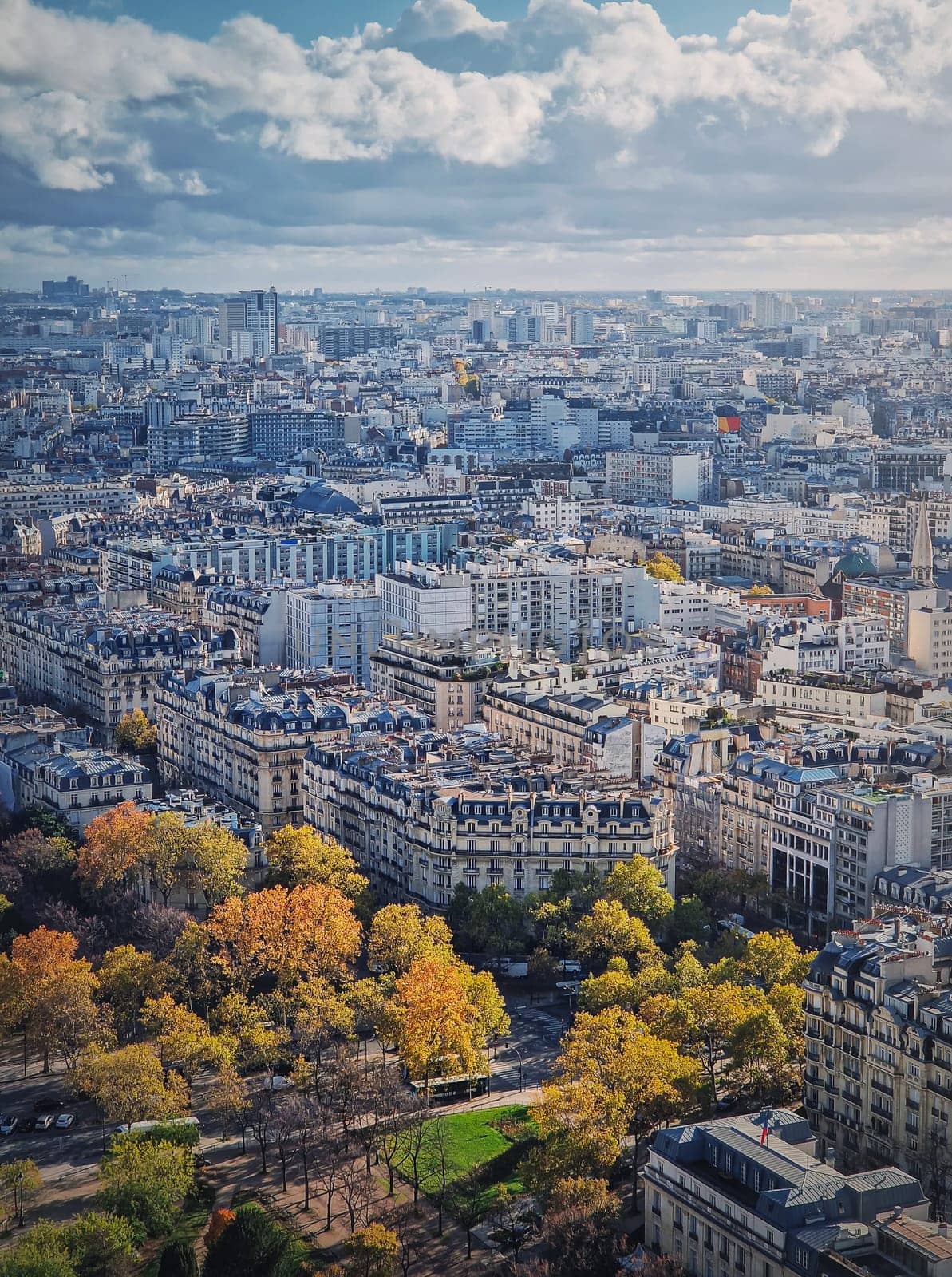 Paris cityscape vertical view from the Eiffel tower height, France. Fall season scene with colored trees by psychoshadow