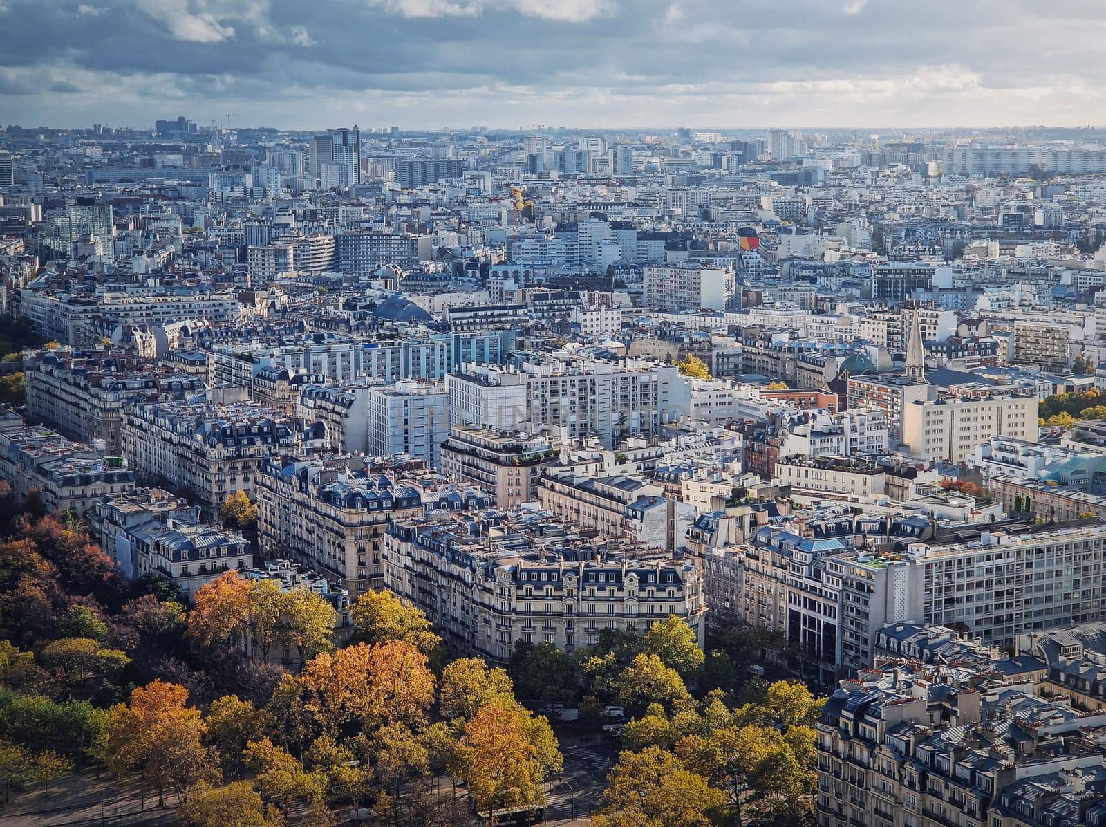 Paris cityscape view from the Eiffel tower height, France. Fall season scene with colored trees by psychoshadow