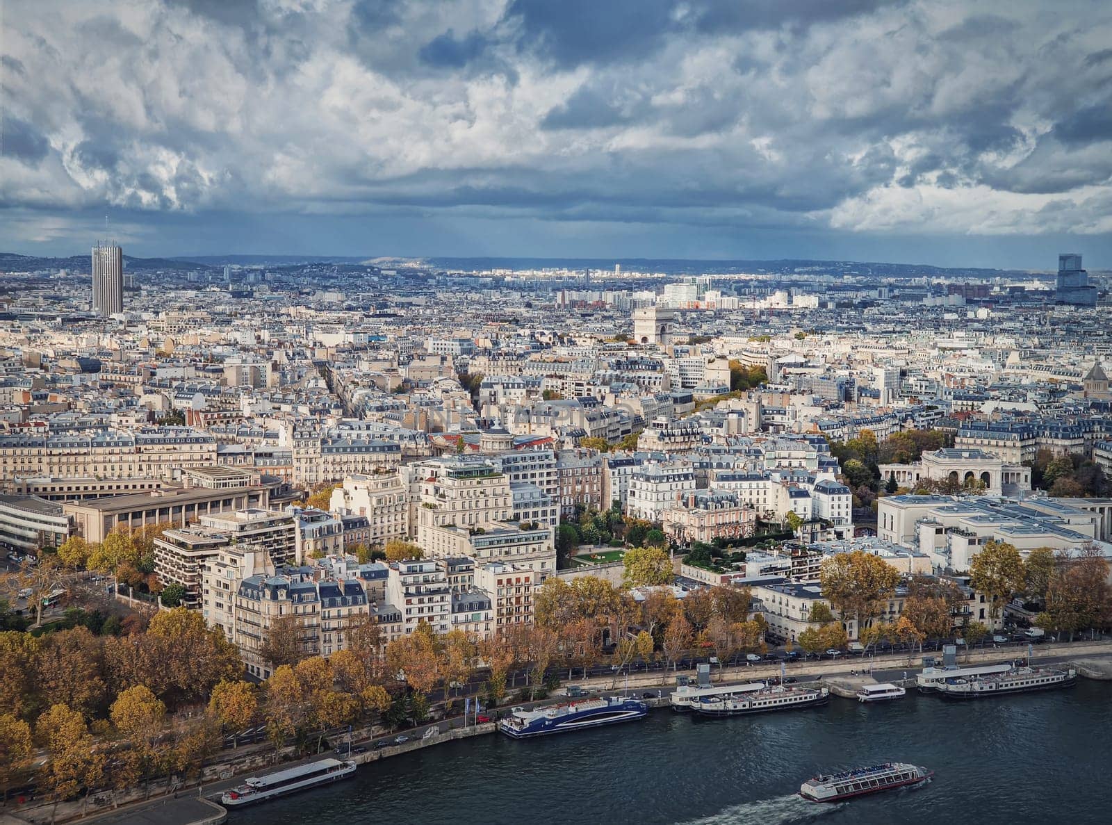 Paris city aerial sightseeing view over the Seine river. Beautiful seasonal panorama with colorful autumn trees by psychoshadow