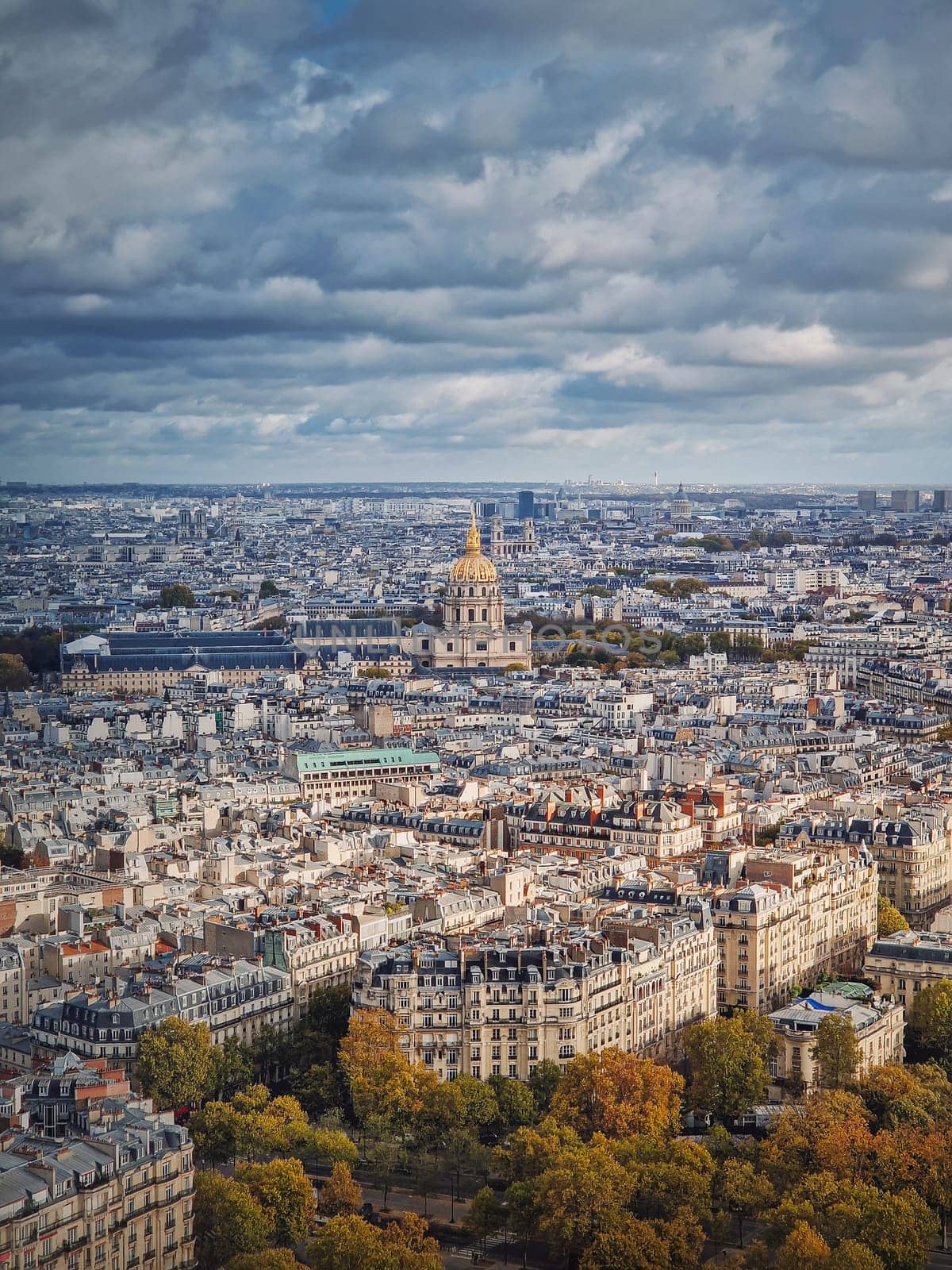 Aerial view of Paris cityscape, France. Les Invalides building with golden dome. Autumn parisian scene, vertical background by psychoshadow