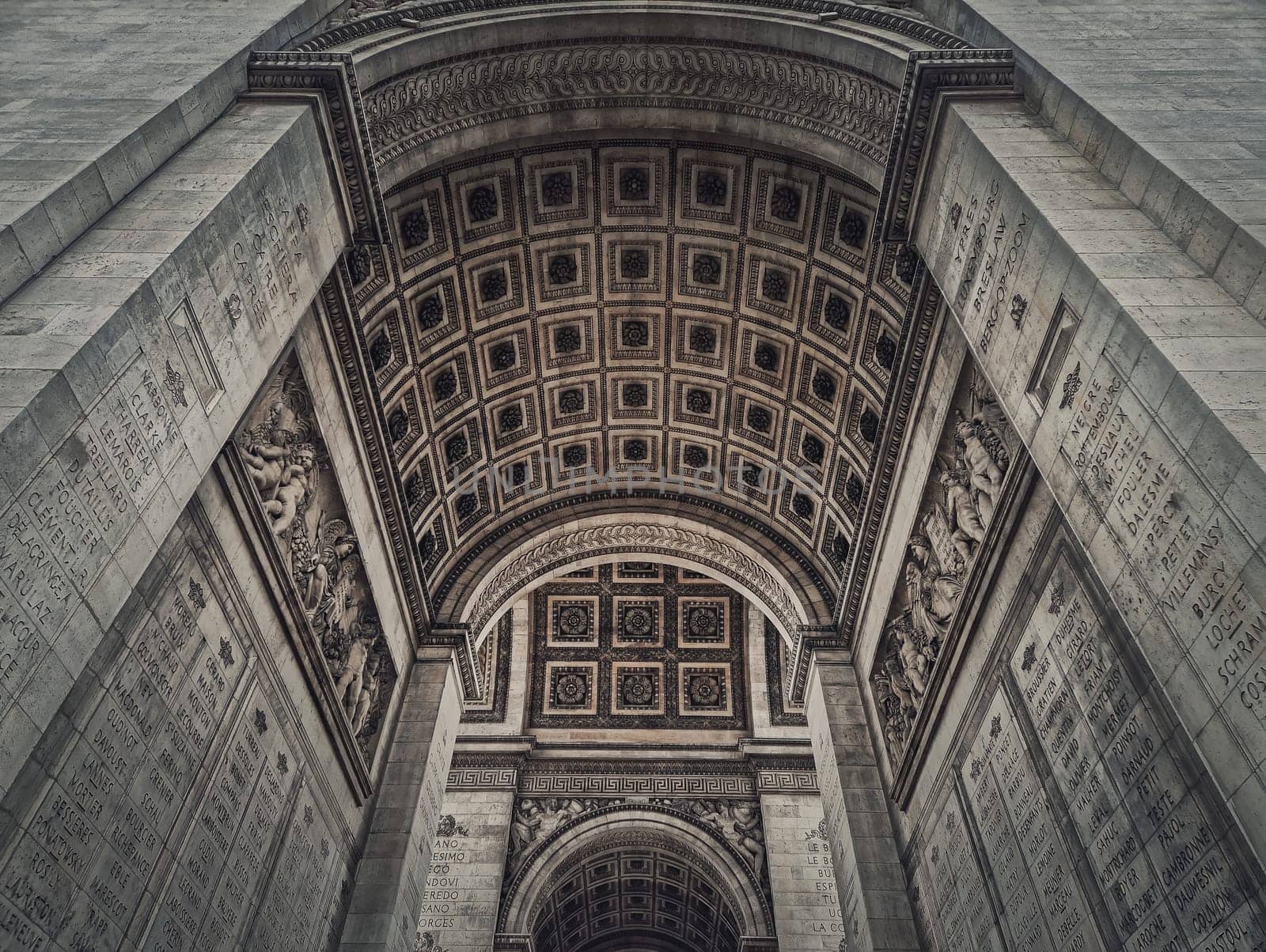 View underneath triumphal Arch, in Paris, France. Architectural details of the famous Arc de triomphe landmark	 by psychoshadow